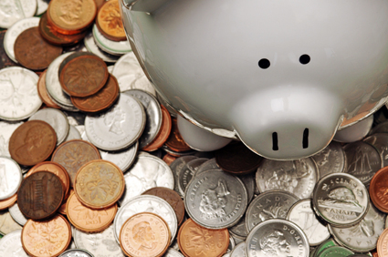Piggy bank surrounded by coins