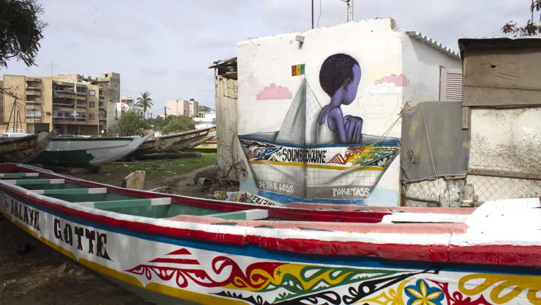 Urban art raising awareness of migration in the Soumbedioune fish market in Dakar