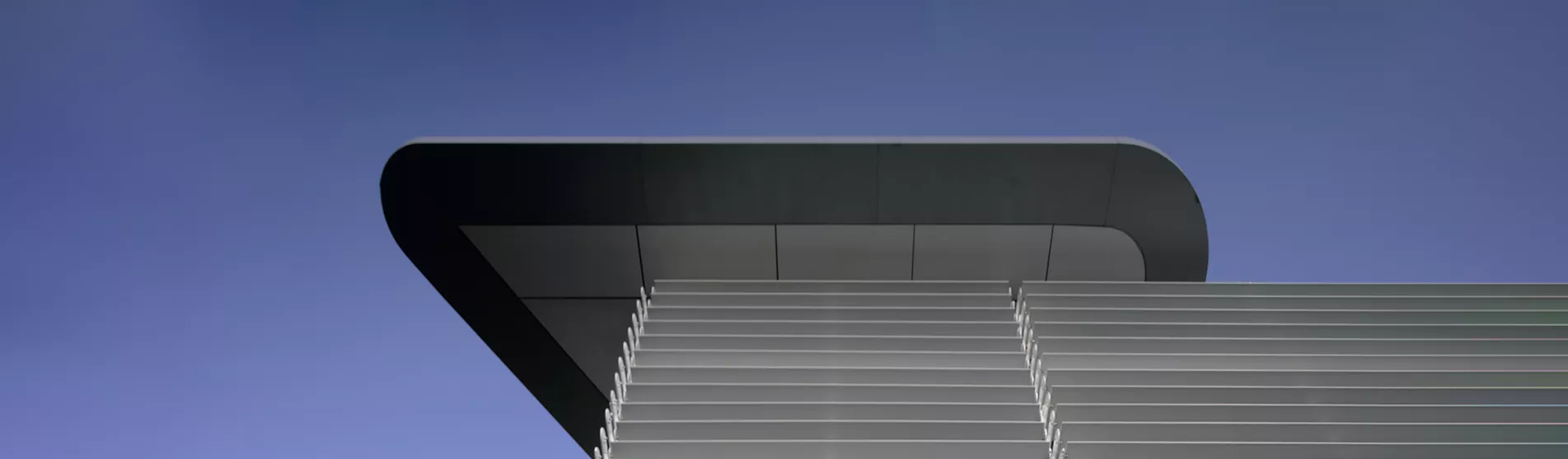 cicely-saunders-institute-exterior-campus building blue sky csi 1903x558