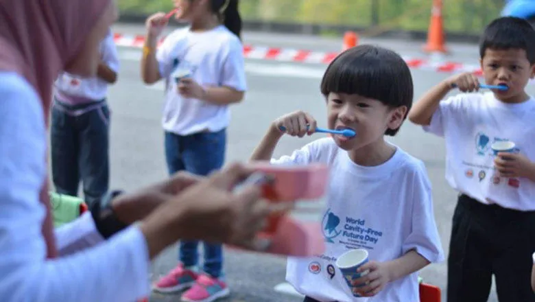Young boy brushing his teeth as part of World Cavity-Free Future Day Activities from the ACFF Malaysian Chapter