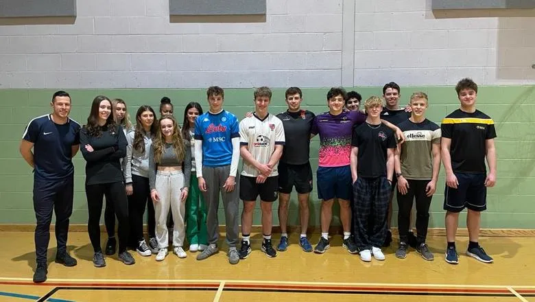 Ross Edmonds with TASS Student-Athletes in Sports hall