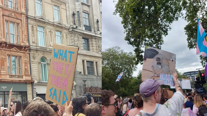 Protesters marching for Trans Pride London 2023 holding signs.