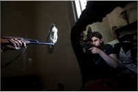 Sniper reflected in mirror in Syrian conflict
