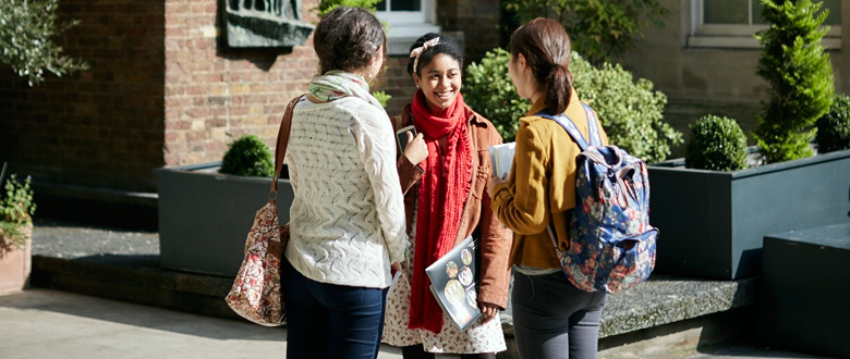 Students chatting in the Strand quad.