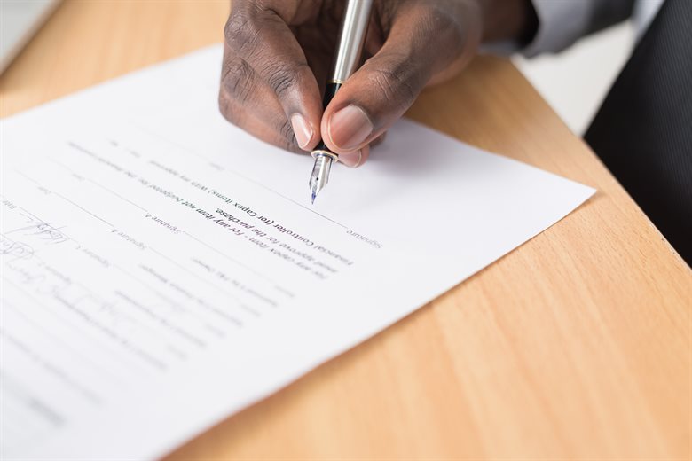 Decorative image of signing a contract