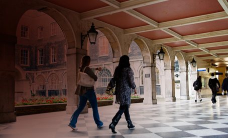 students walking guys campus