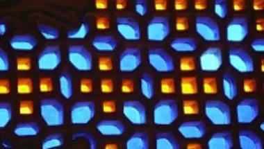 image of a stained glass window with blue and yellow flower patterns.