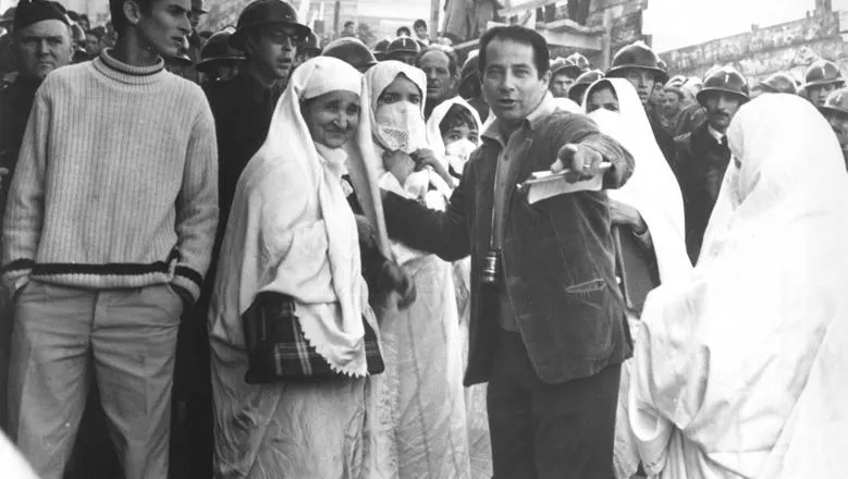 An image of a group of people on a film set in black and white 