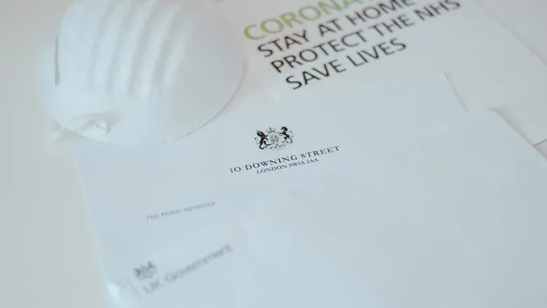 Letter from 10 Downing Street with a face mask on top