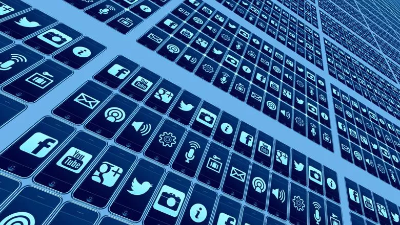 Various social media logos on a grid of smart phones