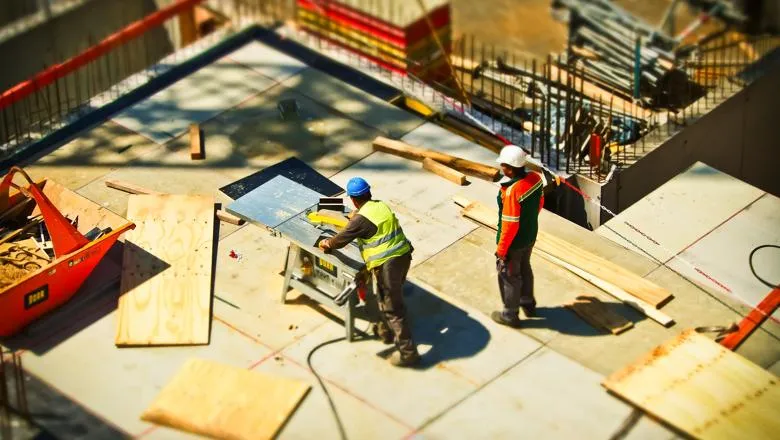 Image of two workers on a construction site