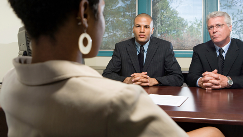 Black Woman At Job Interview Being Judged By Male Interviewers