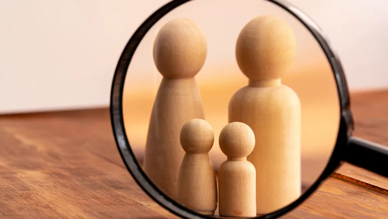 Small wooden figures of family members. Family relationship symbol