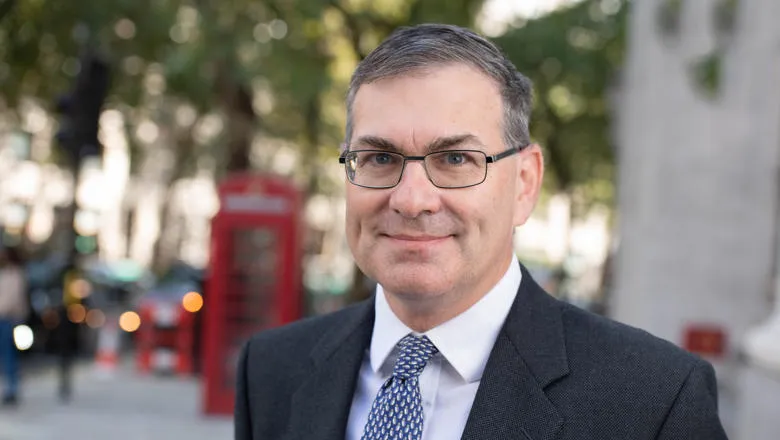 Stephen Bach standing in front of Bush House