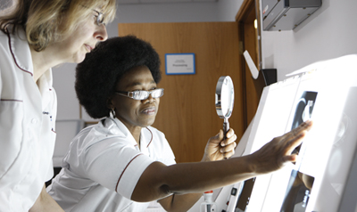 Nurse looking at x-ray
