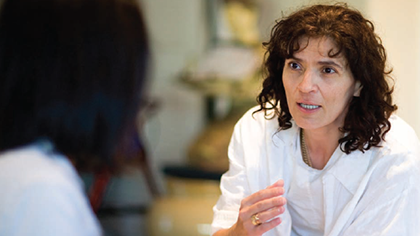 Two women conversing in cognitive behaviour therapy session