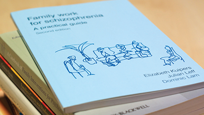 Pile of guides on schizophrenia on a desk