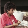 Woman sorting cocoa beans