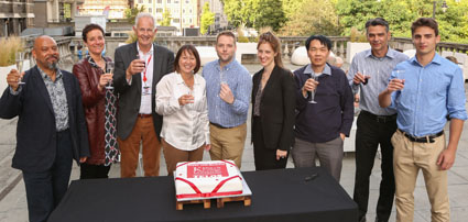 TELOS members with celebration cake