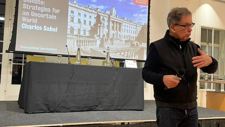 lecturer standing with a microphone in his hand