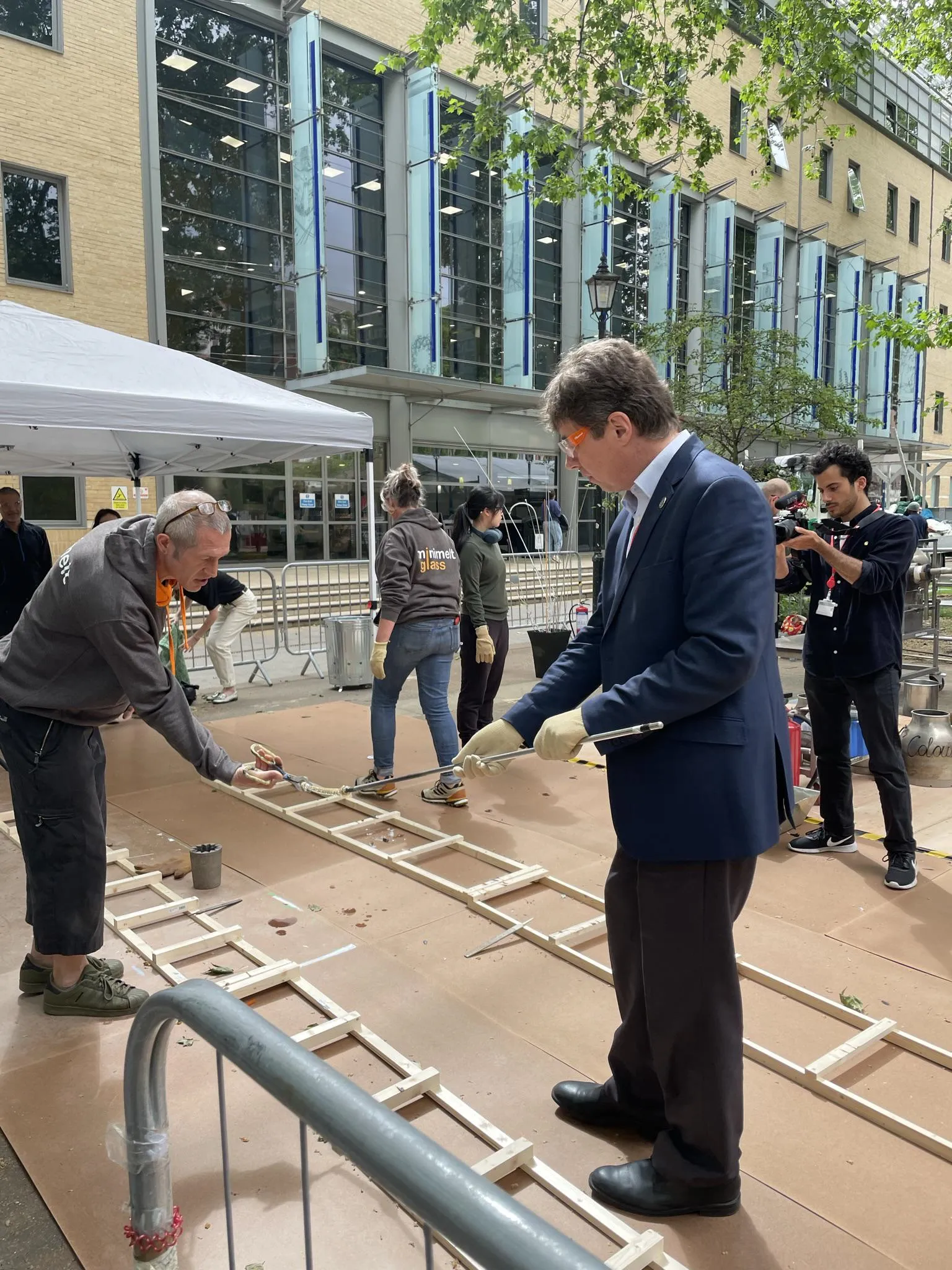 Professor Anatoly Zayats making glass at the event.