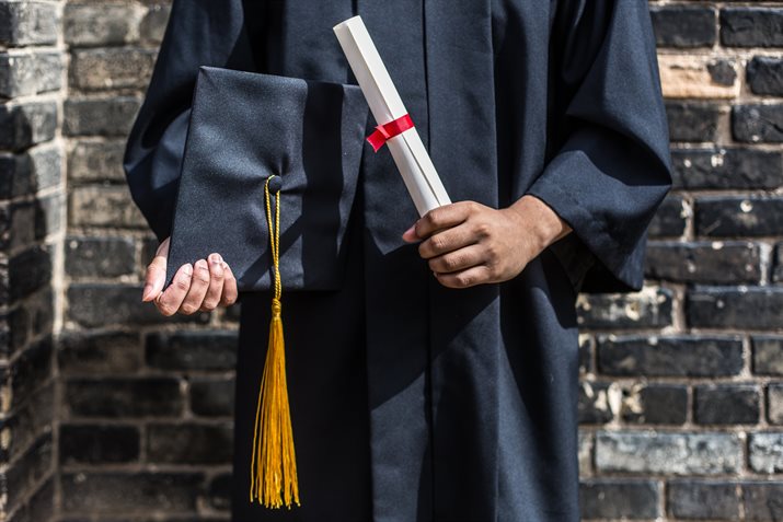 Grad with cap and diploma