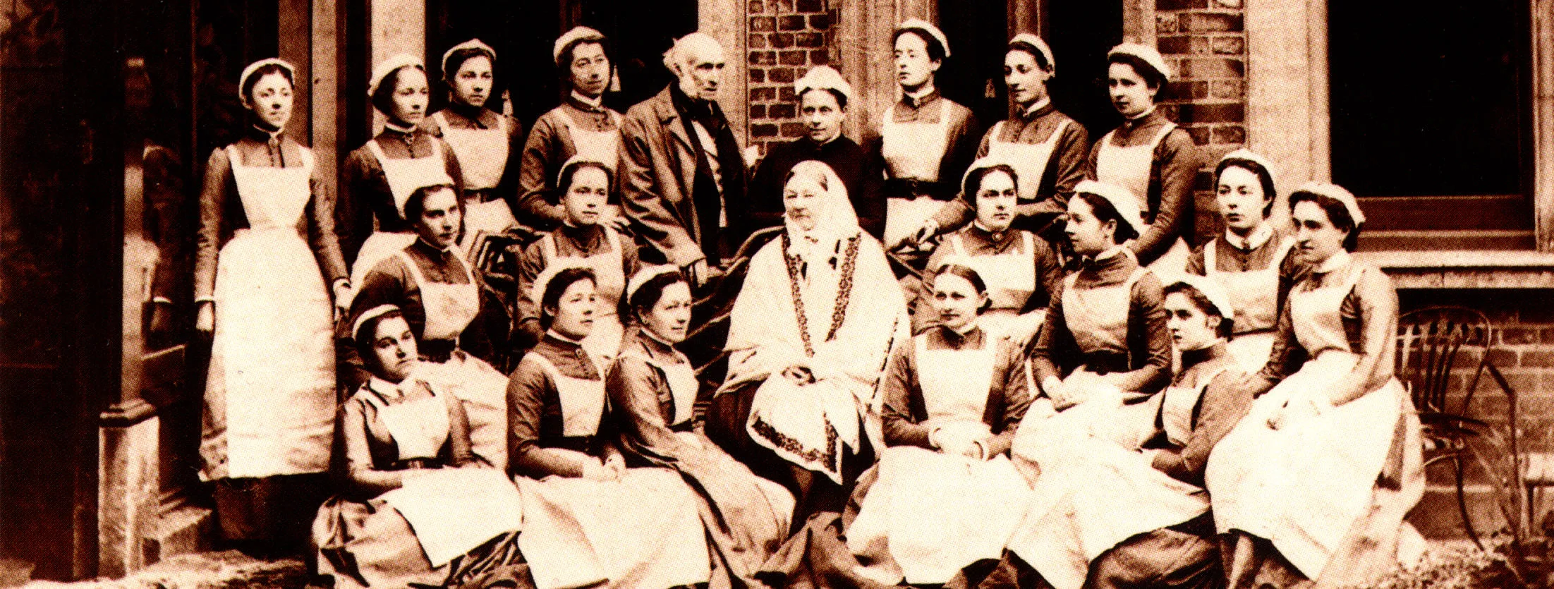 Florence Nightingale in 1886 (centre, seated) with a group of Nightingale nurses and her brother-in-law Sir Harry Verney.