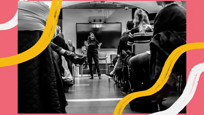 Image of a woman speaking in front of an audience