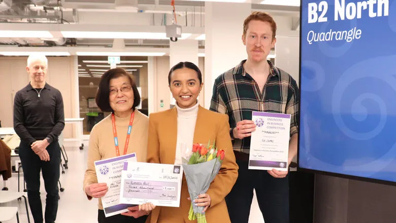 Photo of three finalists holding their certificates