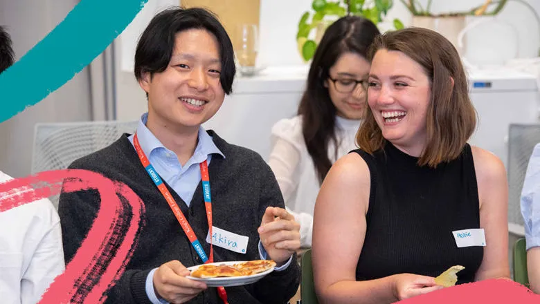 Two students laughing