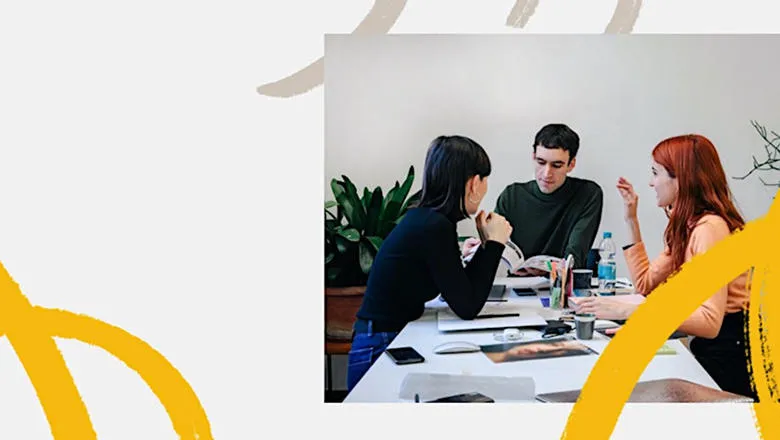 people sitting around table talking