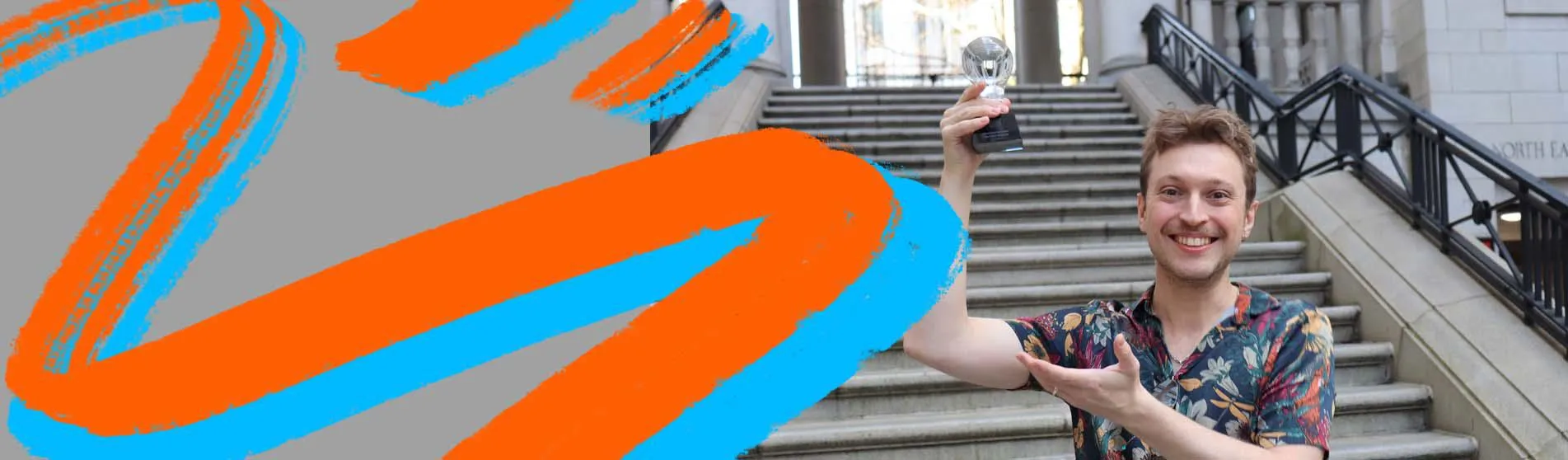 Mateusz Hess, co-founder of LadanBio, holding Idea Factory trophy