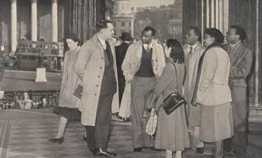 Group of students from the former British Empire, with the City of London in the background. From: Britain aids the colonies. Great Britain. Central Office of Information
