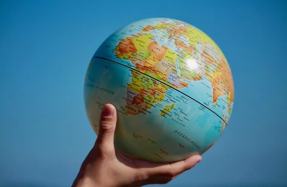Hands holding a world globe
