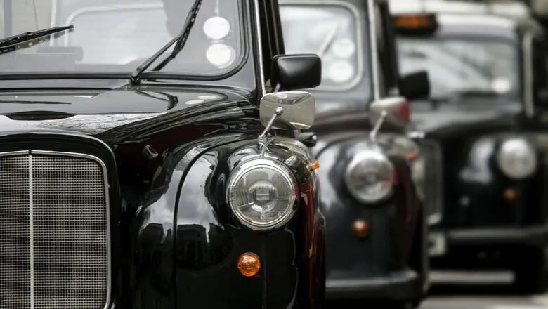 row of black taxis