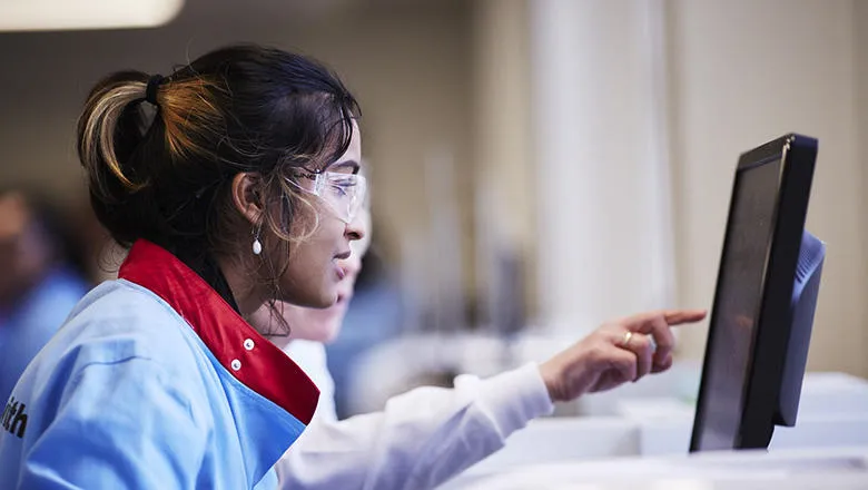 Students wearing lab coat and goggles