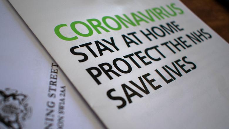 A government booklet front cover that says: Coronavirus. Stay at home. Protect the NHS. Save lives.