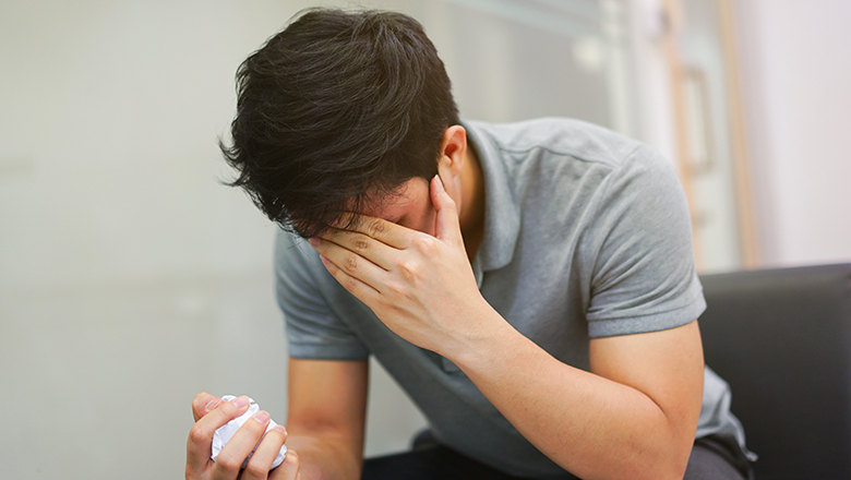 Man holding head in pain