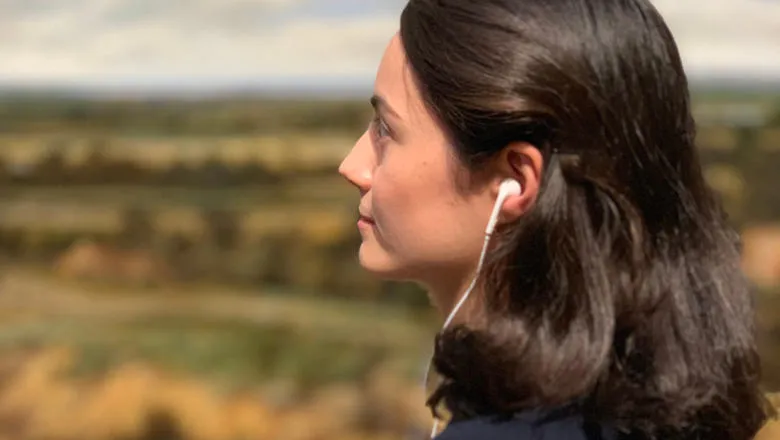 Woman listening to headphones