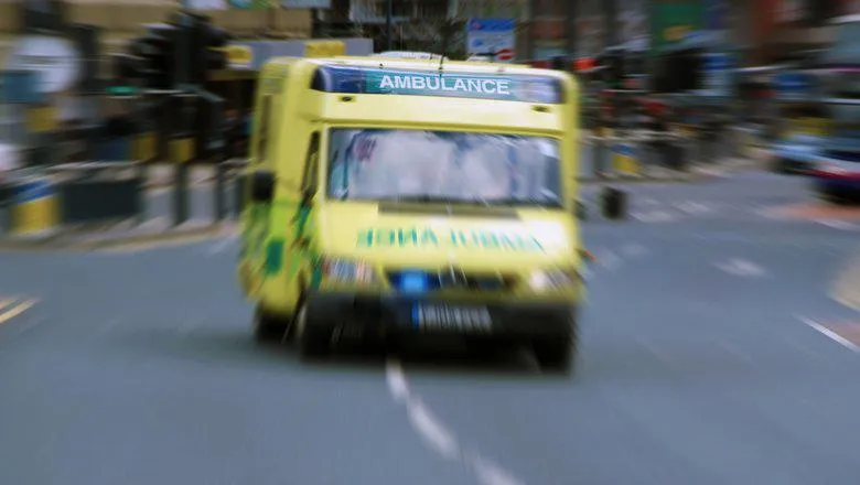 Ambulance on the streets of london - lights flashing, blurred photo indicating speeding vehicle