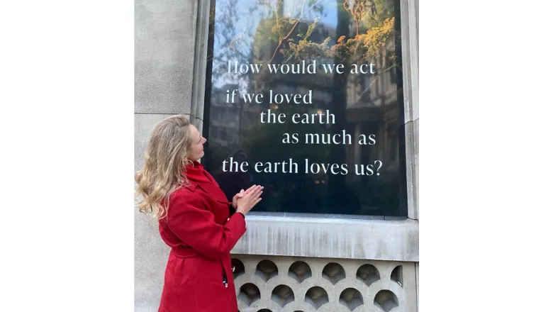 Professor Megan Bowman in front of one of the vinyls on the Strand (c) Reuben