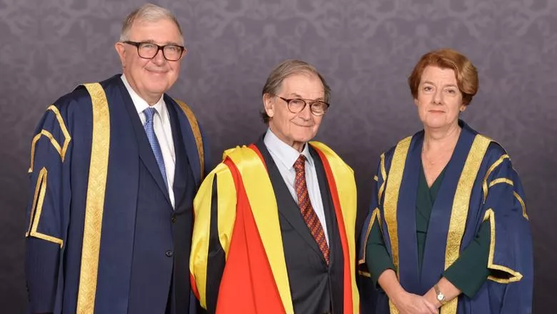 Group in academic gowns with Sir Roger Penrose OM FRS