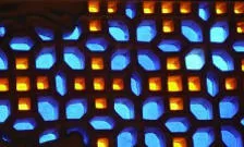 image of a stained glass window with blue and yellow flower patterns.