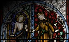 Stained glass window depicting two saints