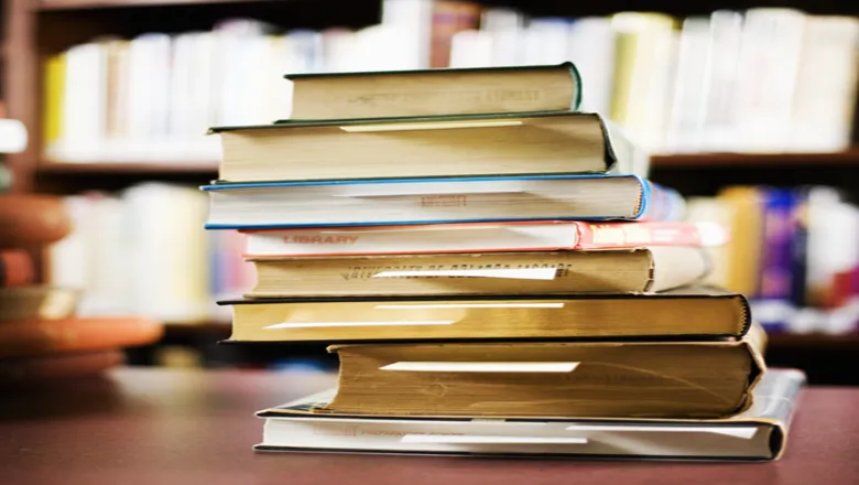 king's dissertation results A stack of coloured books in a library