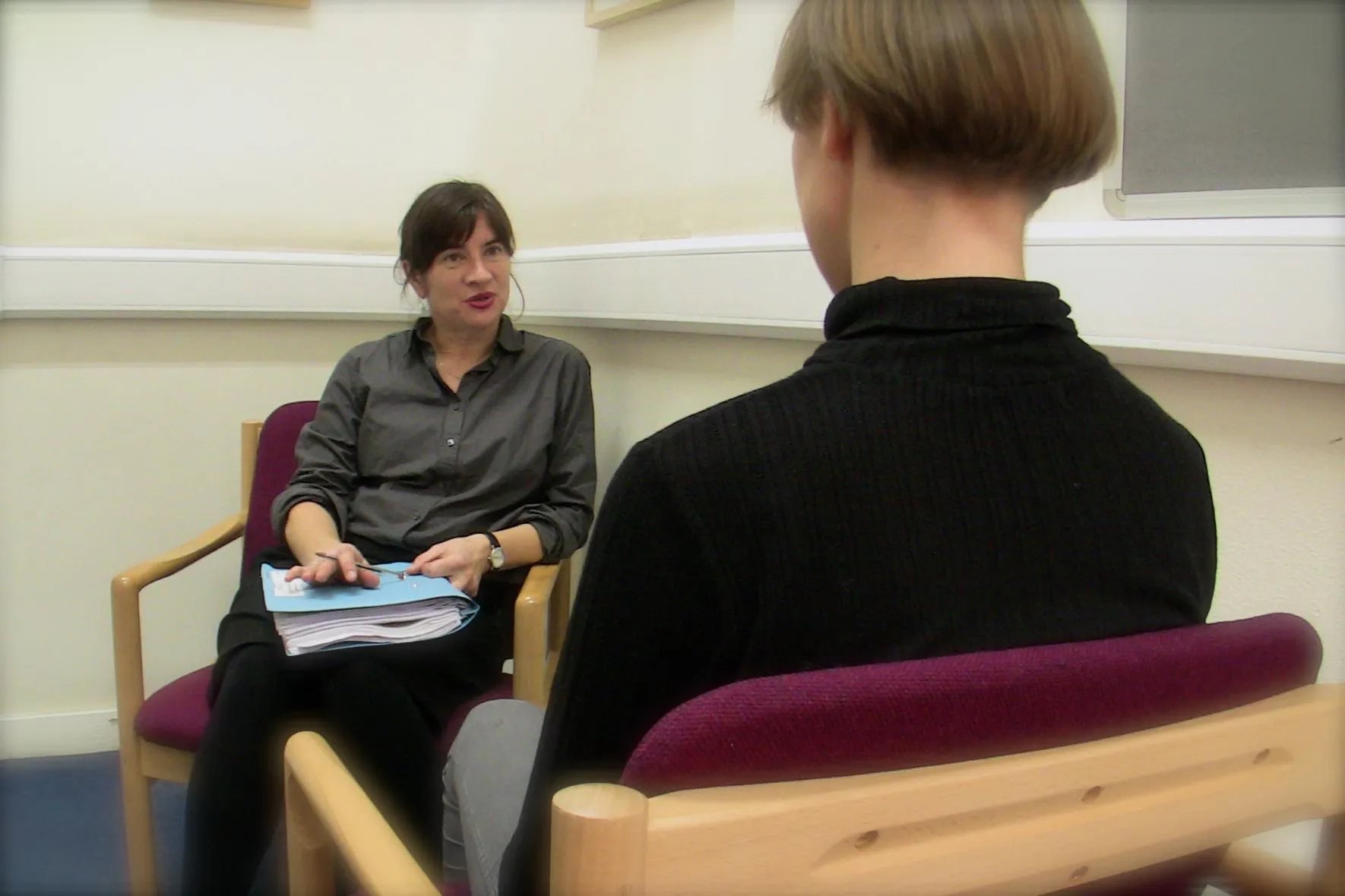 Two women talking during a therapy session
