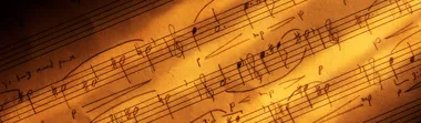 Close up of sheet music in warm yellow light
