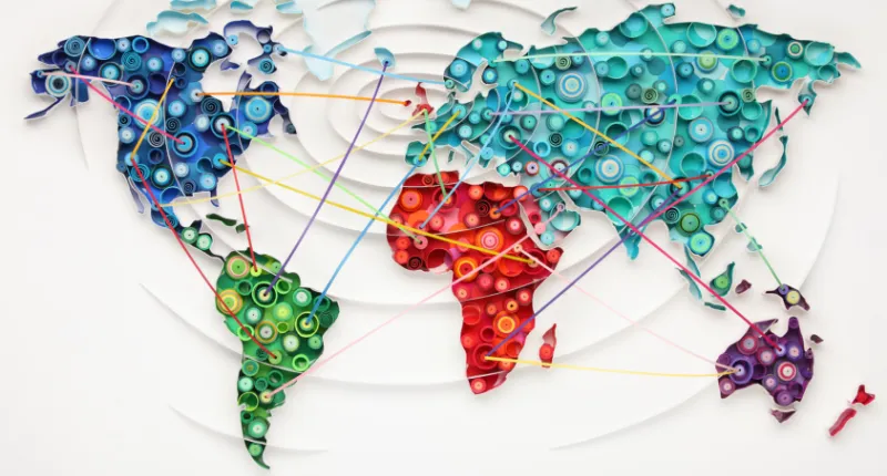 A colourful map of the world with lines showing demonstrating connections between countries.