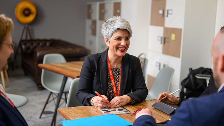 Woman and man in conversation smiling
