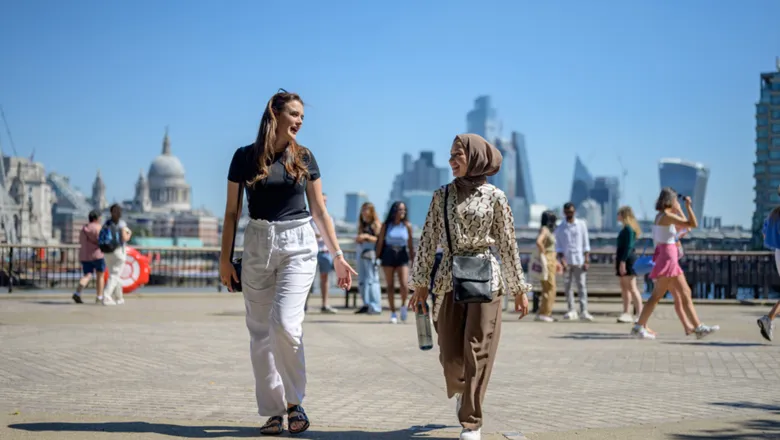 Skyline - students walking over bridge